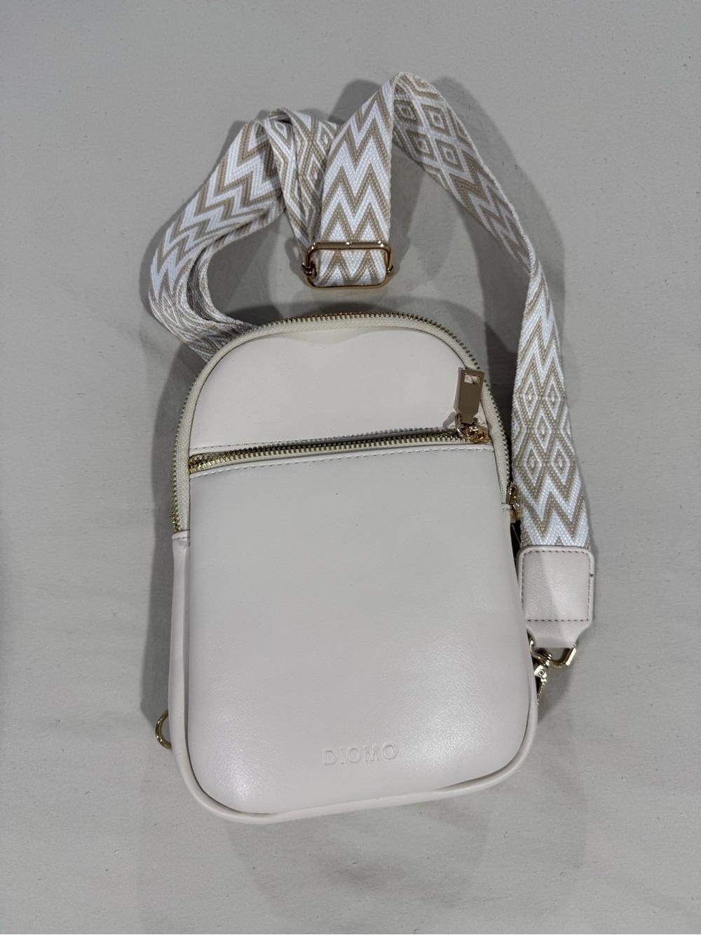 Cream Crossbody Travel Bag with Patterned Strap